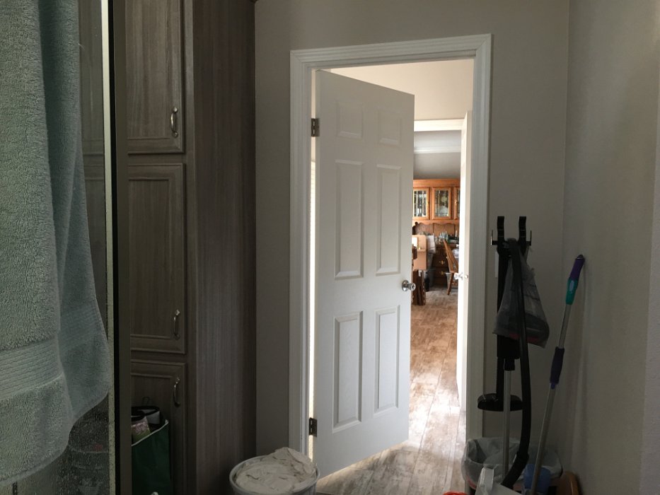 18-Laundry room to kitchen and dining rm, looking from inside master bath.JPG